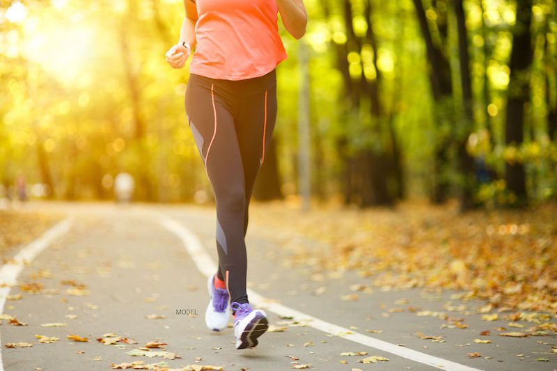 Woman jogging in park.